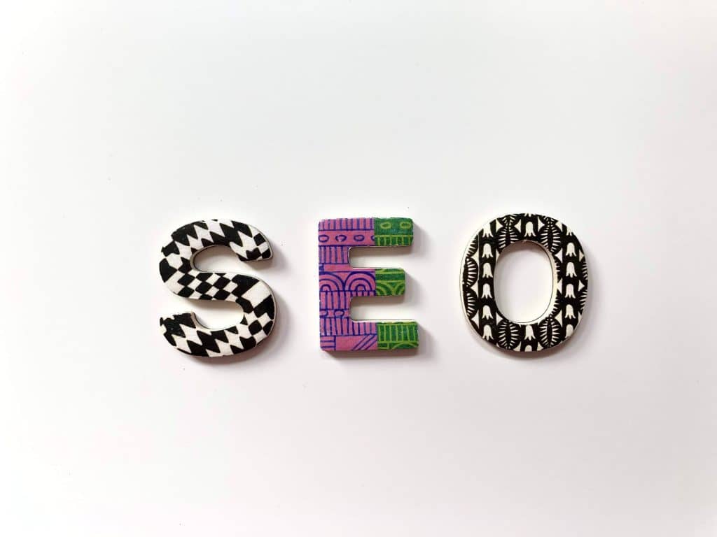 letters spelling out SEO, each decorated in a different multi-coloured pattern 